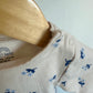 Tan Rib Bodysuit with Blue Flowers / 3-6m