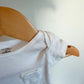 White Cotton Pocket Bodysuit / 0m
