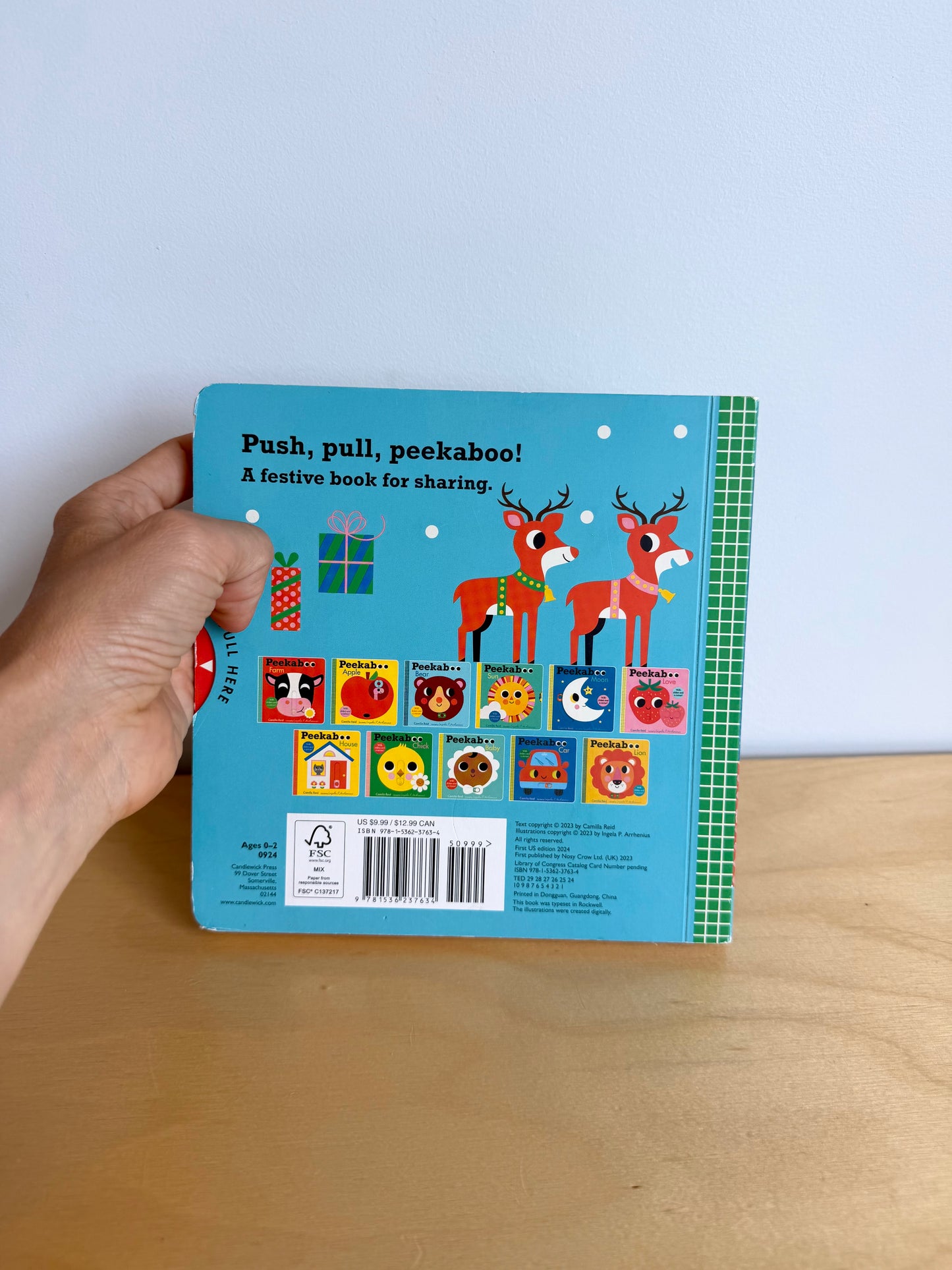 Peekaboo Santa: Sliders + Mirror Book / 0-2 years