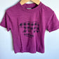 Purple t-shirt with a bear graphic and 'Tofino Canada' text 