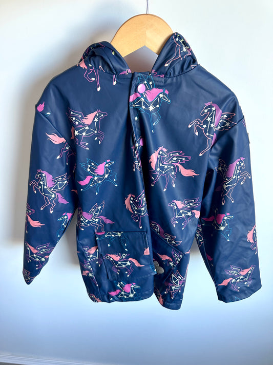 Navy blue jacket with pink unicorn pattern