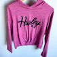 Pink long-sleeve crop top with 'Hurley' logo 